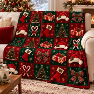 May include: A plush throw blanket featuring a repeating grid pattern of Christmas icons including decorated pine trees, red stockings, plaid gift boxes, candy canes, Santa hats, and tartan bows, all accented with small gold snowflake motifs.