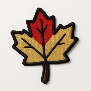 May include: Embroidered maple leaf patch in red and gold, with black edging. The leaf has a detailed, textured appearance, and a brown stem. Suitable for application on jackets, bags, or other fabric items.