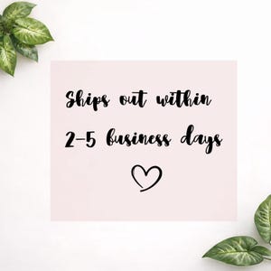 May include: A light pink square with the text "Ships out within 2-5 business days" in black cursive font. A black heart is below the text. Green leaves are in the corners.