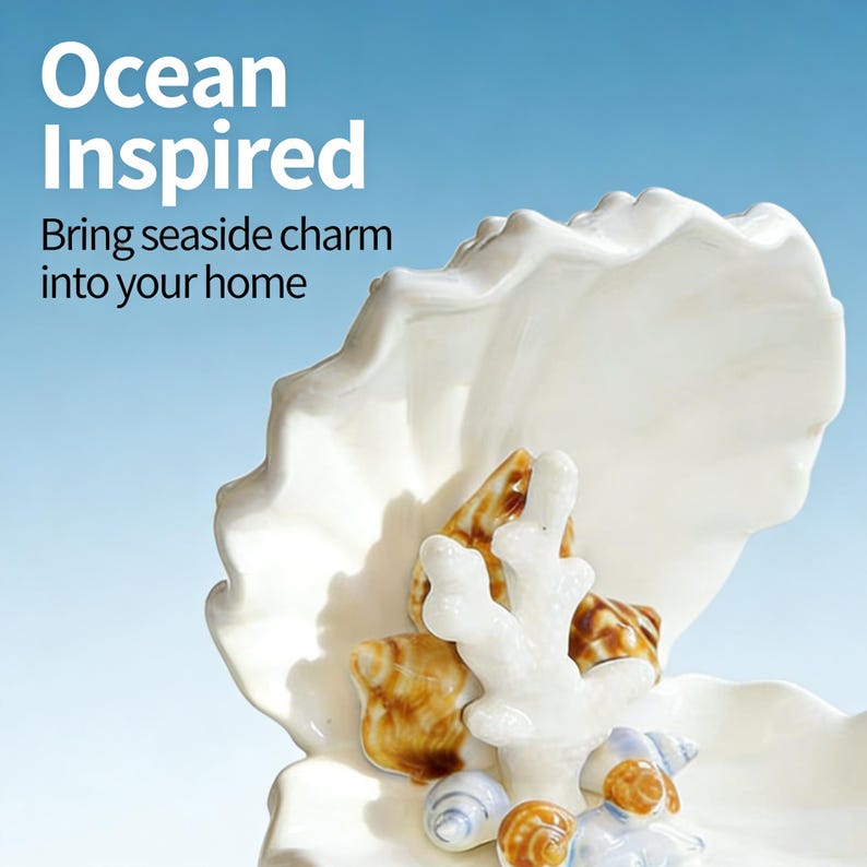 May include: A white ceramic seashell-shaped dish with a collection of seashells and coral. The dish is filled with various seashells in shades of brown, white, and blue. The text "Ocean Inspired" and "Bring seaside charm into your home" are visible.