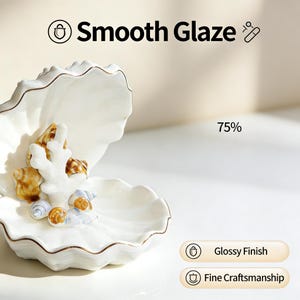 May include: A white ceramic seashell-shaped dish with a glossy finish, featuring a detailed coral and seashell arrangement. The dish has a gold trim and the text "Smooth Glaze". The image also includes the text "Glossy Finish" and "Fine Craftsmanship".