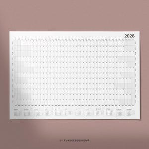 May include: A white 2026 yearly calendar with a grid layout, featuring monthly calendars at the bottom. The calendar includes the days of the week and dates, with the year printed in the upper right corner. The text "BY TUKEKESDESIGNO" is at the bottom.