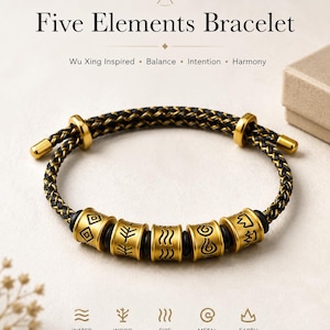 May include: A braided black and gold cord bracelet featuring five cylindrical gold-toned beads, each engraved with a distinct black symbol representing water, wood, fire, metal, and earth. The bracelet includes two adjustable gold-toned end caps.