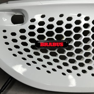 May include: A set of three ceramic mugs with a speckled, matte finish. The mugs are in shades of cream, light gray, and dark gray. Each mug has a simple, minimalist design and a rounded handle. Perfect for coffee or tea.