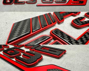 Emblema posteriore AMG GLS 63S in metallo rosso e carbonio, stile Brabus 2025