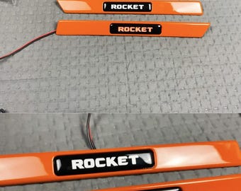Logo Brabus insère un garde-boue orange avec une LED pour Mercedes G Wagon