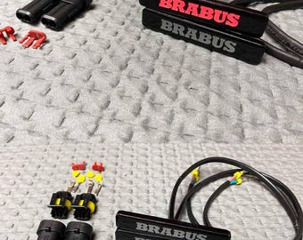 Inserts LED rouges avec badge fusée pour garde-boue Mercedes Brabus