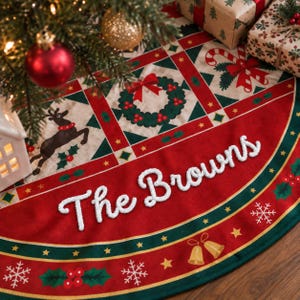 May include: A circular Christmas tree skirt featuring a red and green patchwork design with holiday motifs including reindeer, wreaths, candy canes, and holly. The fabric is personalized with the white embroidered text The Browns.