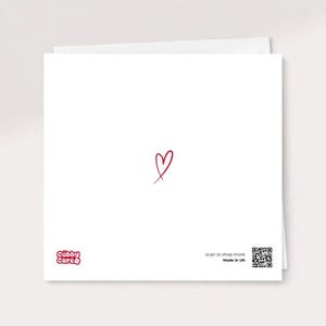 The reverse side of a white square greeting card featuring the minimalist Cubby Care Official logo, a small red heart, and a "Made in UK" label with a scannable QR code.