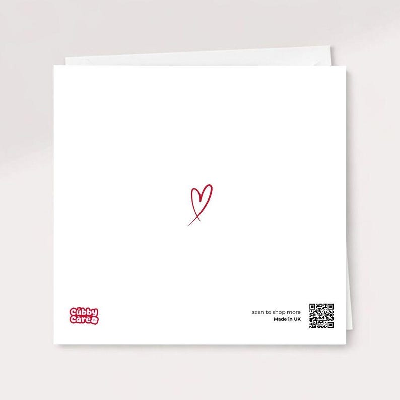 The reverse side of a white square greeting card featuring the minimalist Cubby Care Official logo, a small red heart, and a "Made in UK" label with a scannable QR code.