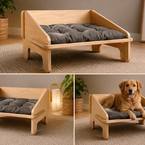 May include: A light-colored wooden pet bed featuring a low-profile frame with angled side panels and a thick, tufted dark gray rectangular cushion. The structure is supported by four sturdy legs, providing a raised platform for a pet to rest.