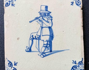 Dutch Delft Tile man playing the flute