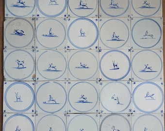 A set of 25 antique 18th/19th-century Delft tiles. Dutch Delft blue, circle tiles with animals, wall tiles for a backsplash or fireplace.