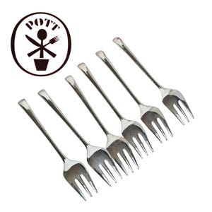 May include: Six silver forks with three tines each, arranged diagonally. The forks have a simple, elegant design. A circular logo with the word "POTT" and crossed utensils is in the upper left corner.
