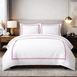 May include: White bedding set with a magenta border. The set includes a duvet cover and two pillowcases. The bedroom setting features a neutral color palette with a wooden nightstand and a gold lamp.