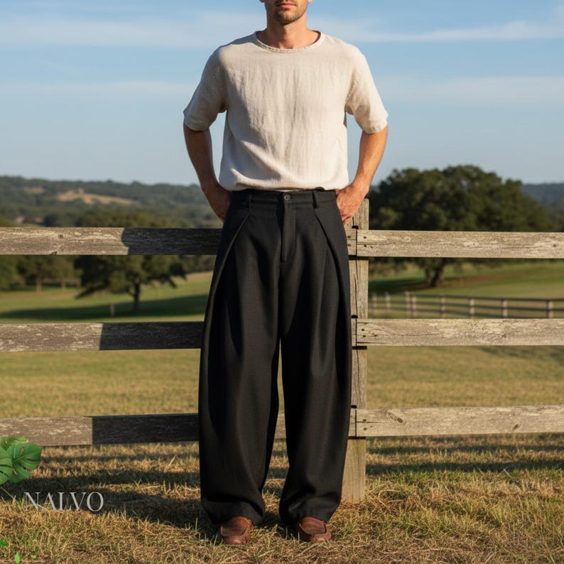 Black wide leg pleated pants for men, baggy straight-leg trousers with minimalist streetwear style and relaxed fit