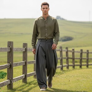 Grey pleated wide leg trousers for men, loose-fit tailored slacks with cross-pleat detail and clean minimalist look