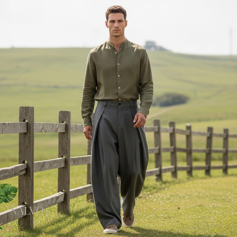 Grey pleated wide leg trousers for men, loose-fit tailored slacks with cross-pleat detail and clean minimalist look