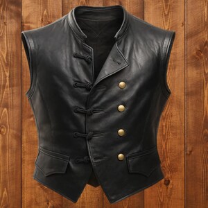 May include: A black leather vest with a mandarin collar and a double-breasted design. The vest features four gold-colored buttons and decorative knot closures. Two small pockets are visible at the waist.