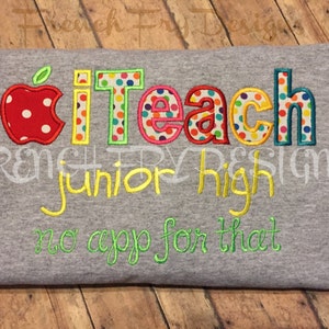 May include: A gray t-shirt with the text "i teach junior high no app for that" embroidered in yellow, green, and red. The word "teach" is in colorful polka dot letters.