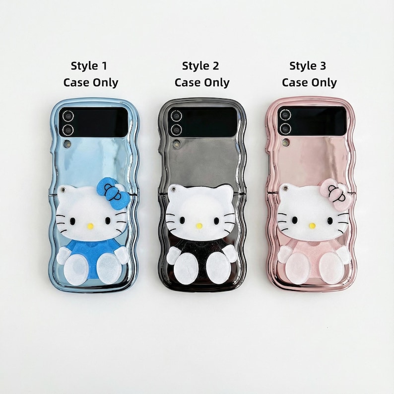 May include: Three phone cases featuring a Hello Kitty design. The cases are in blue, gray, and pink, each with a different outfit and bow. The text "Style 1 Case Only", "Style 2 Case Only", and "Style 3 Case Only" are printed above each case.