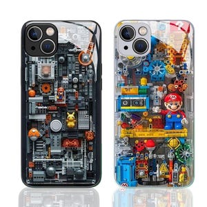 May include: Two phone cases with intricate designs. One case is black with a gray mechanical design and the other is clear with a colorful design featuring a Mario figure. Both cases have camera cutouts.