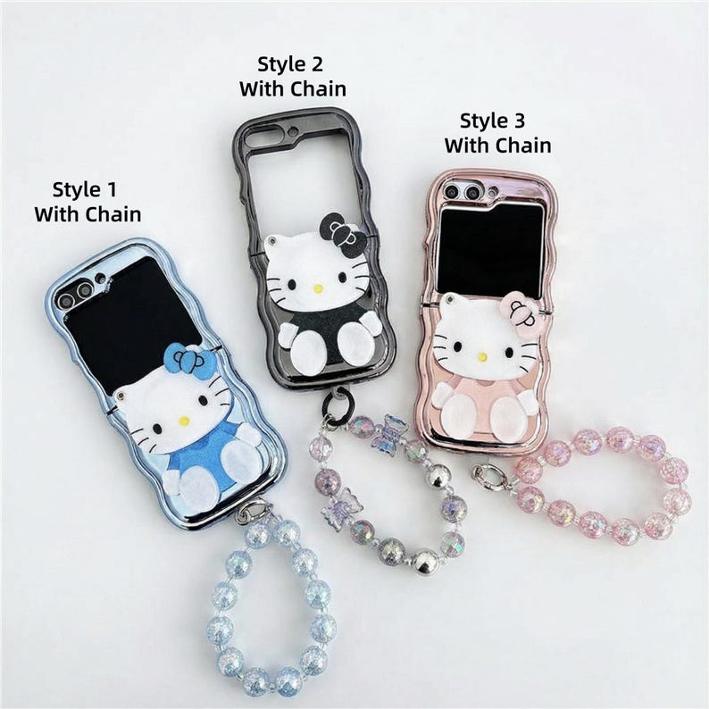 May include: Three phone cases featuring the Hello Kitty character, each with a different color scheme and a matching beaded chain. The cases are in blue, black, and pink, with the text "Style 1 With Chain", "Style 2 With Chain", and "Style 3 With Chain".