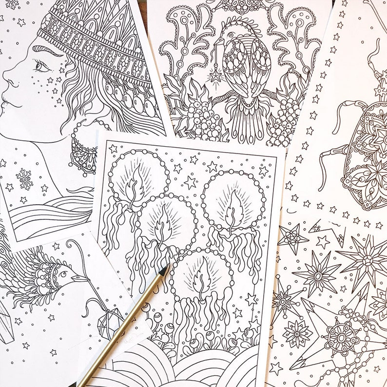 May include: A collection of intricate black and white coloring pages featuring various designs. The pages include illustrations of a woman's profile, a bird, candles, and geometric patterns. A gold pencil rests on the pages.