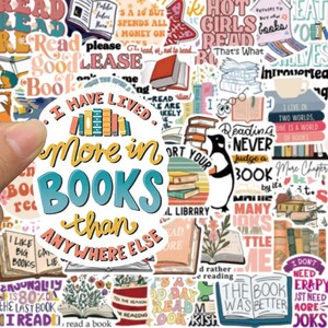 May include: A collection of colorful stickers with book-themed quotes and illustrations. The central sticker reads "I have lived more in BOOKS than anywhere else." Other stickers feature books, penguins, and phrases like "Reading Never Judge a Book".