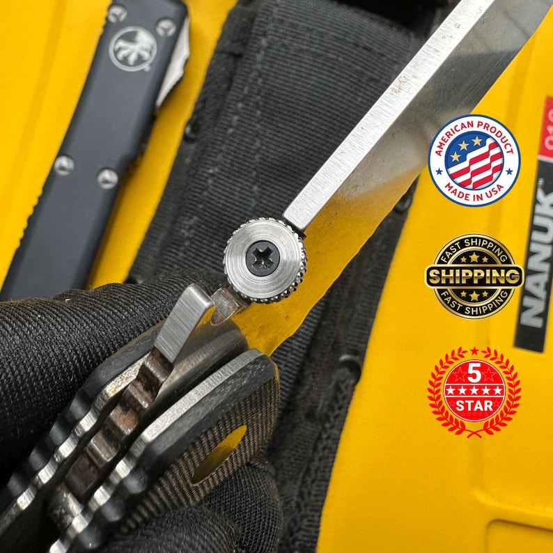 May include: Close-up of a partially open folding knife with a silver blade and a black handle. The knife is set against a yellow background. The image also shows a black knife and the text "AMERICAN PRODUCT MADE IN USA".