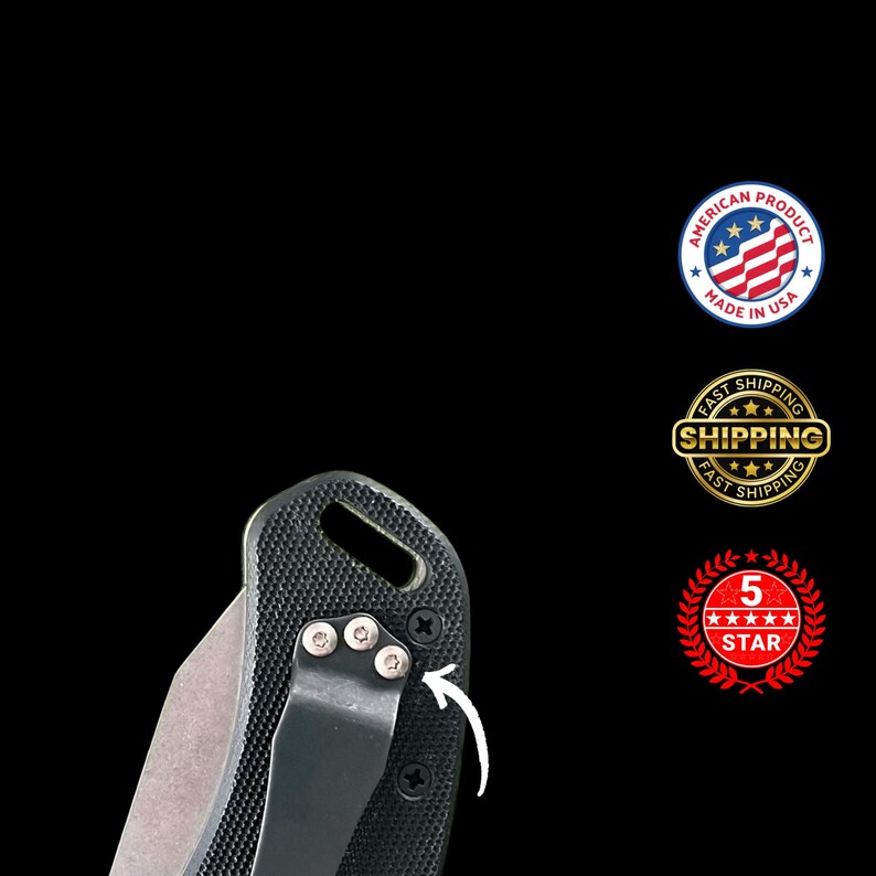 May include: Close-up of a black folding knife with a textured handle and a silver blade. The knife has a pocket clip and is marked "Made in USA". The image also includes a "5 Star" emblem.
