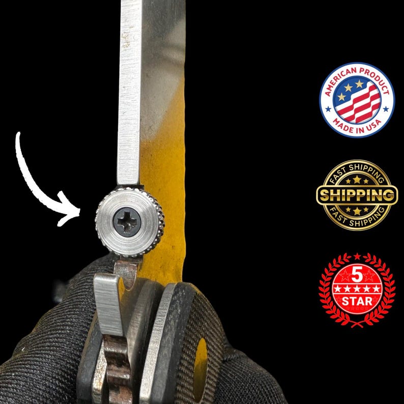 May include: Close-up of a partially open folding knife with a silver blade and a textured, circular screw. The blade is positioned against a yellow surface. The image includes a "Made in USA" seal and a "Fast Shipping" seal.