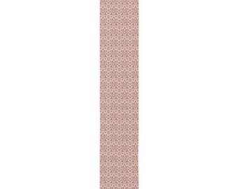 May include: A long, rectangular table runner featuring a dense, repeating damask pattern in shades of muted red, white, and dark grey. The intricate design consists of symmetrical floral and scrollwork motifs covering the entire surface.
