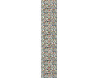 May include: A long, rectangular table runner featuring a dense, repeating floral pattern. The design consists of intricate orange, yellow, blue, and green botanical motifs set against a light, off-white background, creating a vibrant, symmetrical textile.