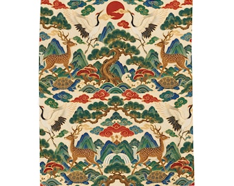 May include: A rectangular fabric tapestry featuring a repeating pattern of white cranes, brown spotted deer, and turtles amidst green mountains, pine trees, red clouds, and a large red sun. The design incorporates detailed natural elements.