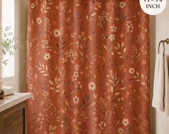 May include: A rust-colored shower curtain featuring a repeating pattern of white and light-colored wildflowers, stems, and leaves. The curtain hangs from a metal rod and measures 71 by 74 inches, as indicated by the text in the upper right corner.