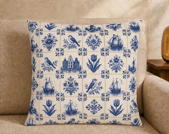 May include: A square throw pillow featuring a grid pattern of blue and white illustrations on a cream background. The design includes depictions of sailing ships, songbirds, tulips, windmills, and traditional Dutch canal houses in a tile style.