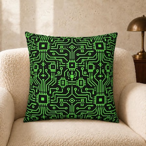 May include: A square throw cushion featuring a black background with a vibrant neon green circuit board pattern. The design displays interconnected lines, geometric nodes, and central processor-like squares, creating a repeating electronic motif.