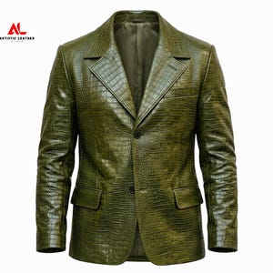 May include: An olive green blazer with a textured crocodile skin pattern, featuring a notched lapel, two front buttons, and two flap pockets. The logo AL ARTISTIC LEATHER STUDIO is visible in the upper left corner of the garment display.