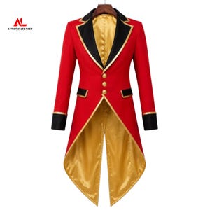 May include: A red tailcoat jacket featuring black lapels with gold trim, three gold buttons on the front, and black cuffs. The interior lining and the back tails are made of a shiny gold fabric. The Artistic Leather Studio logo is visible.