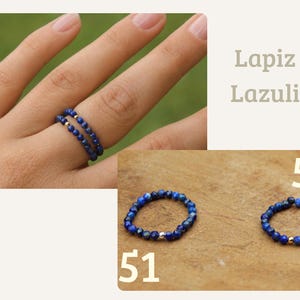 May include: Two rings made of small, faceted, deep blue Lapis Lazuli beads. One ring features a single metallic silver bead, while the other features a single metallic gold bead. The text Lapiz Lazuli, 51, and 52 are visible in the image.