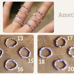 May include: A collection of beaded rings featuring light purple amethyst stones and small metallic beads. The rings are displayed on fingers and individually numbered 13 through 20, with the text Amethyst visible in the upper right corner.