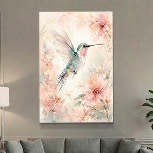 May include: Watercolor painting of a hummingbird in flight, surrounded by soft pink flowers and foliage. The bird has blue, green, and pink feathers. The artwork has a light, airy feel, with a focus on nature and delicate details.
