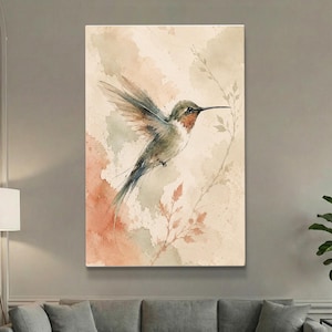 May include: Watercolor painting of a hummingbird in flight. The bird has green, brown, and red tones, with outstretched wings. The background features soft peach and beige watercolor washes, with delicate leaf accents.