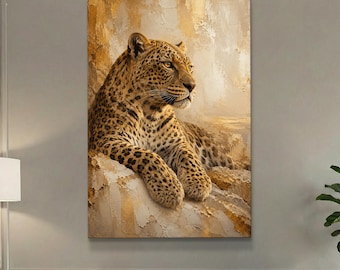 May include: A rectangular wall art print featuring a leopard resting on a textured, golden-toned surface. The leopard has a spotted coat and is looking toward the right side of the frame. The background consists of abstract, layered gold and cream paint strokes.