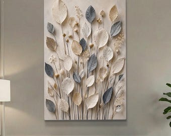 May include: A rectangular wall art piece featuring a 3D relief of stylized leaves and floral elements. The leaves are in shades of white, gray, and beige, creating a natural, textured aesthetic. The artwork is mounted on a neutral-toned background.
