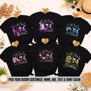 Puede incluir: Camisetas negras con varios diseños para celebrar un 74 cumpleaños. Los diseños incluyen tacones altos, copas de vino y girasoles. El texto en las camisetas dice "It's my 74th Birthday." La parte inferior de la imagen dice "PICK YOUR DESIGN CUSTOMIZE: NAME, AGE, TEXT & SHIRT COLOR."