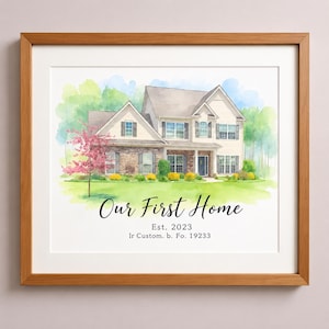 May include: A framed watercolor illustration of a two-story house with beige siding and stone accents, surrounded by green trees and a pink flowering tree. The text reads "Our First Home", "Est. 2023", and "Ir Custom. b. Fo. 19233" in black.