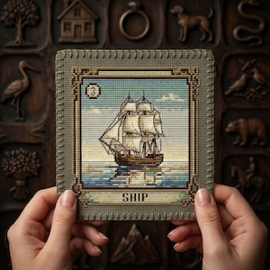 May include: A square cross-stitch embroidery featuring a tall ship with white sails on a blue sea, framed by a decorative border. The number 3 is in the top left corner, and the word SHIP is printed in black at the bottom on a light green background.