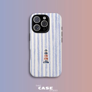 May include: A smartphone case featuring a watercolor design of a lighthouse on a striped background. The case has a blue and white striped pattern and a small lighthouse illustration. The text "THAT CASE STUDIO" is at the bottom.